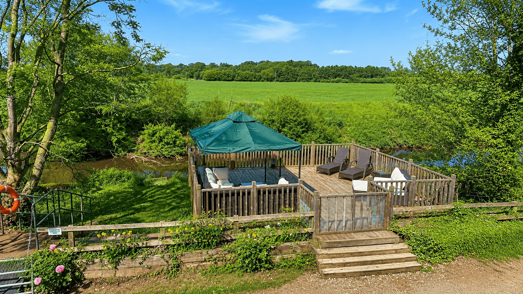 Riverside veranda at Wharfe Bank Cottage overlooking the River Wharfe